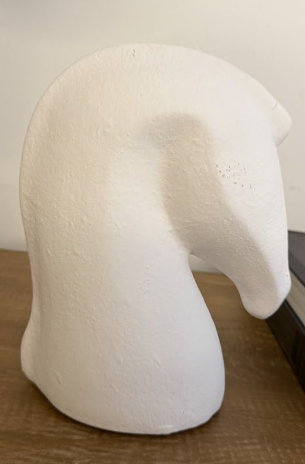 White ceramic horse head statue